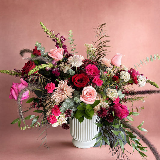 Reds and pinks white urn